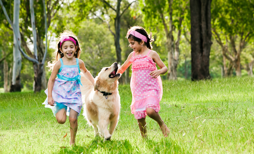 two children with dog